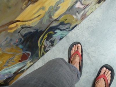 painting and feet of barbra edwards, Canadian abstract artist on Pender Island, BC